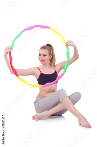 Woman doing exercises with hula hoop © Elnur