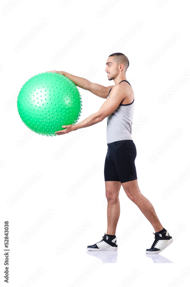Man with swiss ball doing exercises on white Man with swiss ball doing exercises on white