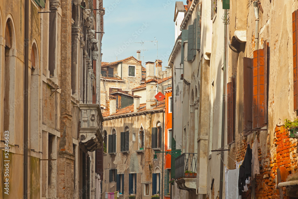 The canals of Venice with colorful houses. Italy.