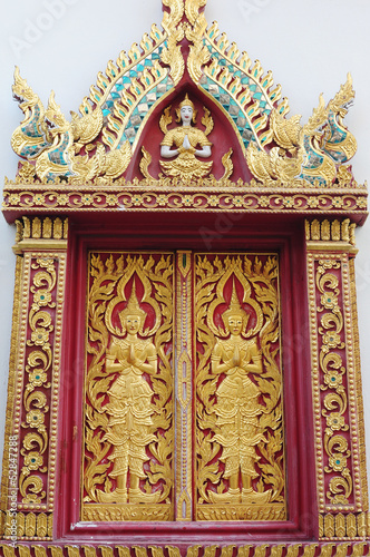Thai temple window in Chiang Mai © bbbar