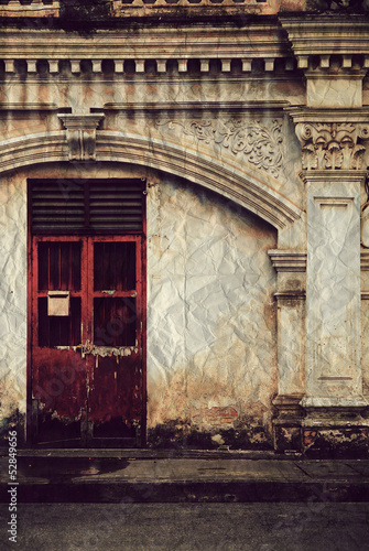 Old red door on old wall  Vintage style