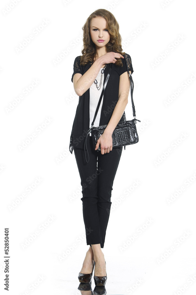 beautiful girl is in fashion style holding a bag beautiful girl is in fashion style holding a bag