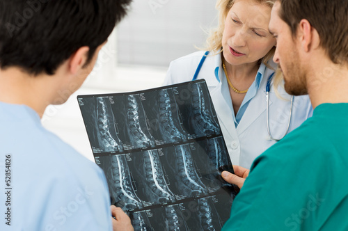 Doctors Examining X-ray Report