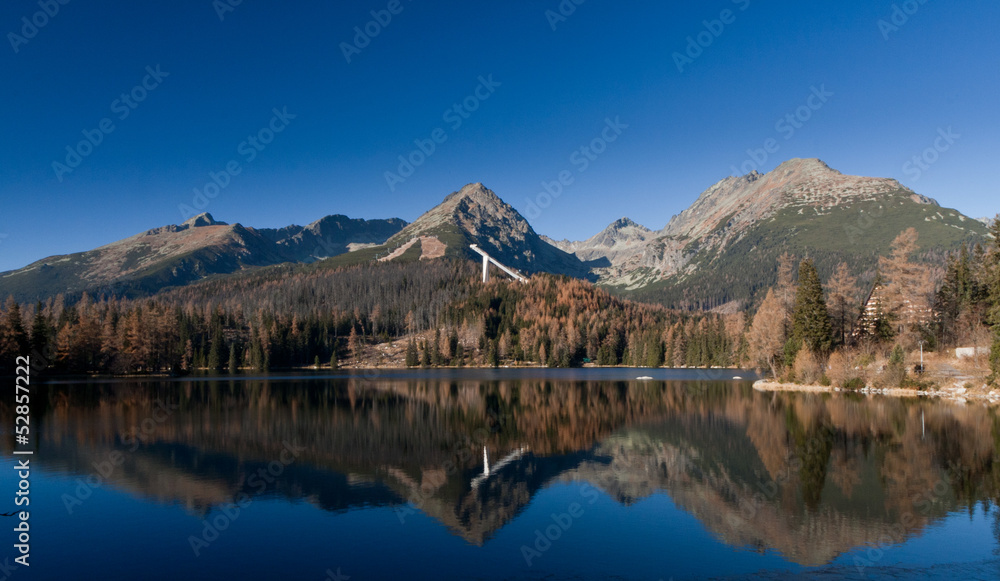 Panorama of High Tatras mirrored in Strbske pleso, Slovakia