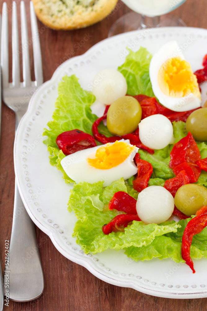 salad with boiled egg and olives