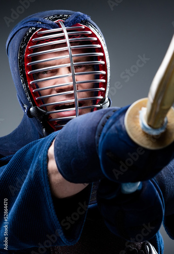 Close up of kendo fighter training with shinai