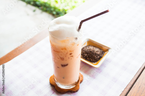 Refreshment glass of cold thai milk tea