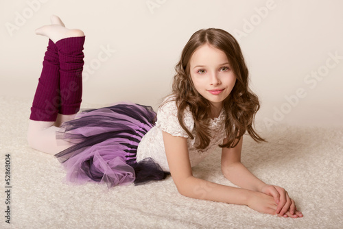 little girl lying on floor