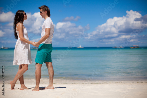 Young couple enjoying each other on a tropical beach
