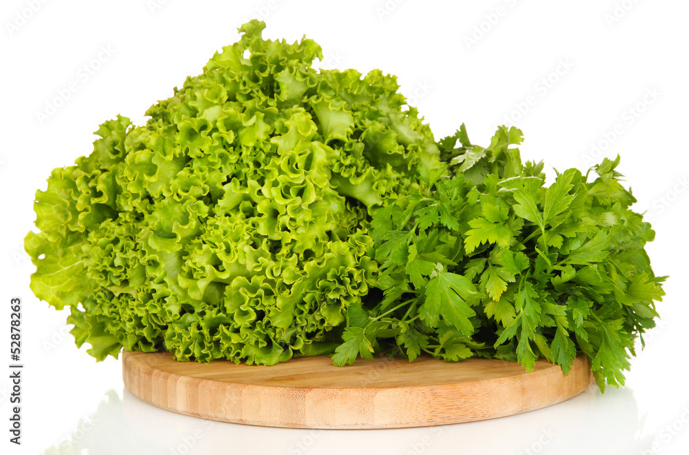 Useful herbs on wooden cutting board isolated on white Useful herbs on wooden cutting board isolated on white