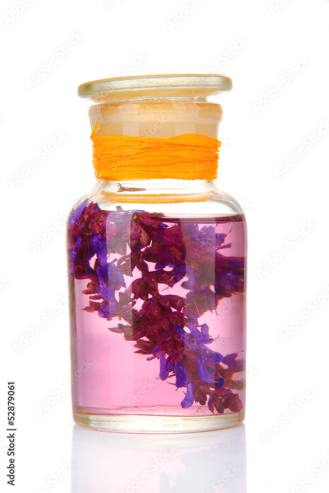 Medicine bottle with salvia flowers, isolated on white Medicine bottle with salvia flowers, isolated on white