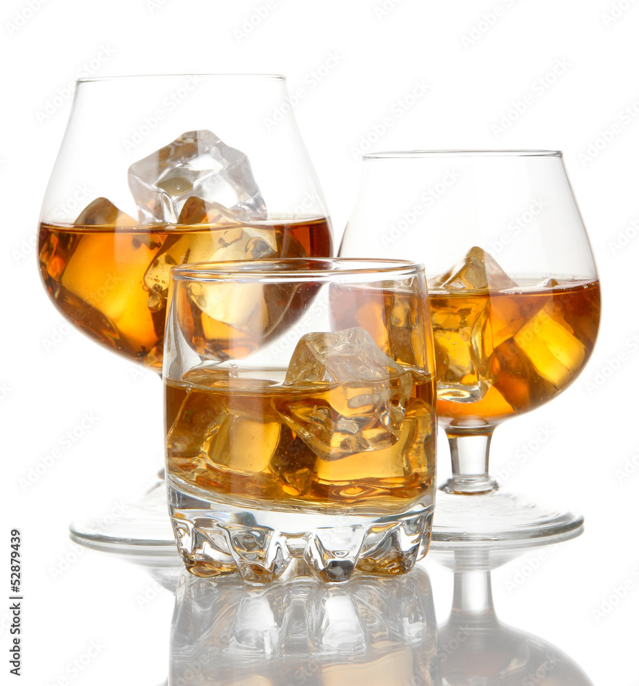 Brandy glasses with ice isolated on white Brandy glasses with ice isolated on white