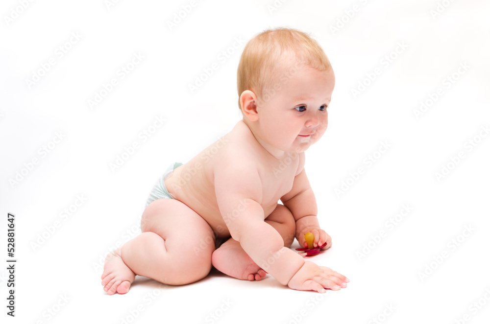 Baby crawling with a pacifier in his hands Baby crawling with a pacifier in his hands
