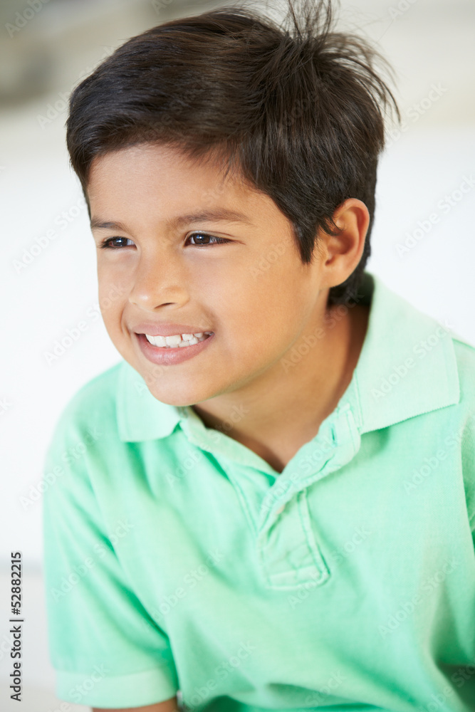 Smiling Boy Sitting On Sofa Smiling Boy Sitting On Sofa