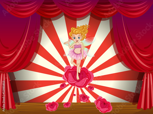 A fairy above the red rose at the stage