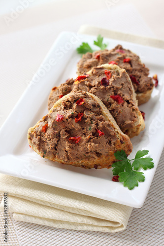 Liver pate with paprika on slices of wholegrain bread