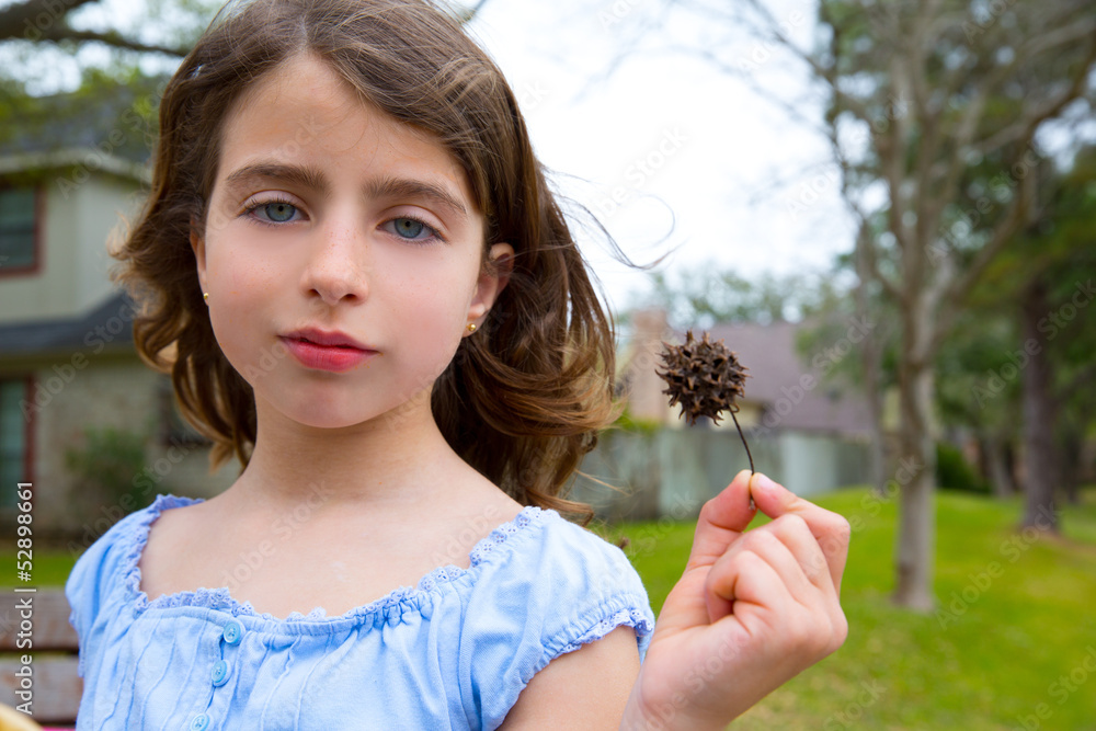 girl portrait with sweetgum spiked fruit on park girl portrait with sweetgum spiked fruit on park