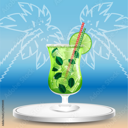 glass with a cocktail on the beach