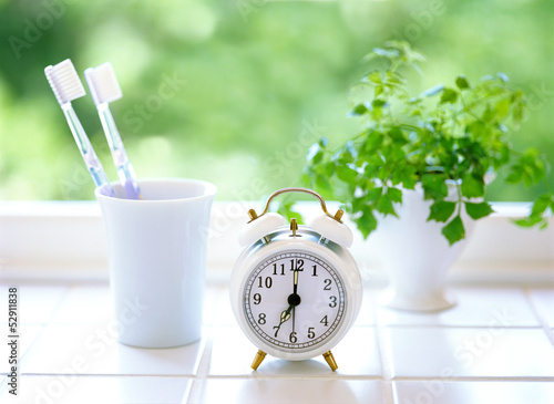 Toothbrush and alarm clock
