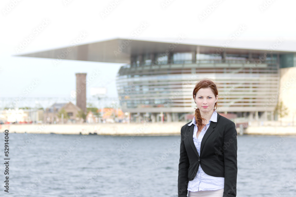 Young adult business woman standing in harbour area Young adult business woman standing in harbour area