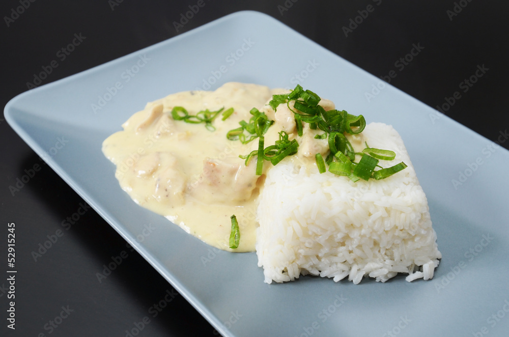 Chicken strips in creamy mushroom sauce, served with rice Chicken strips in creamy mushroom sauce, served with rice