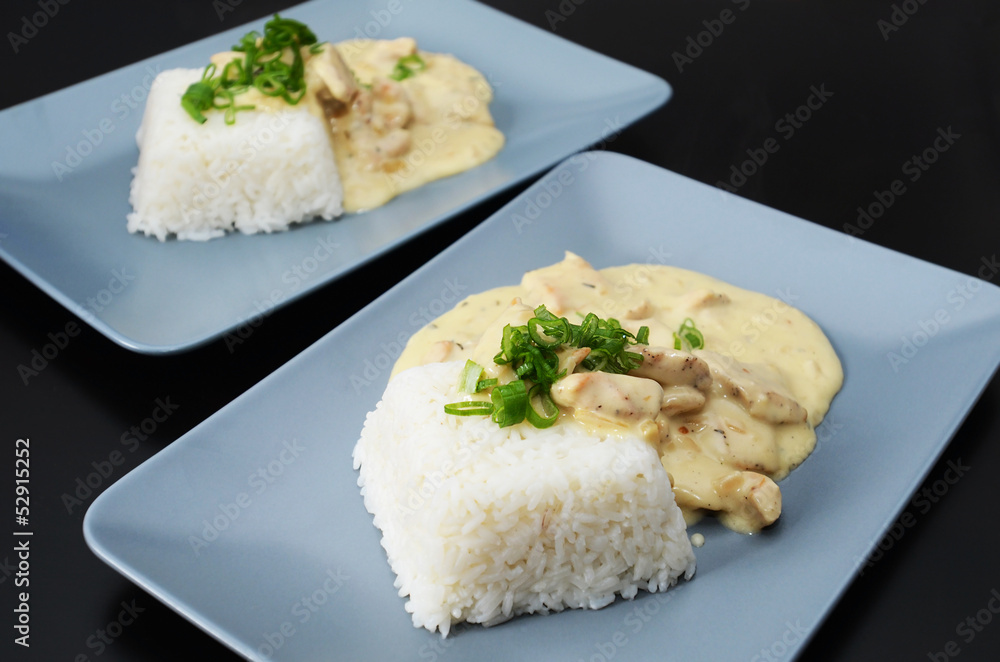 Chicken strips in creamy mushroom sauce, served with rice Chicken strips in creamy mushroom sauce, served with rice