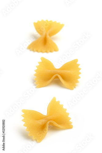 three bow tie pasta on white background