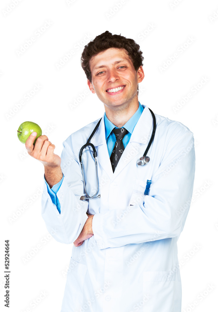 Portrait of a smiling male doctor holding green apple on white Portrait of a smiling male doctor holding green apple on white