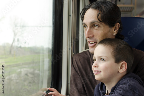 Father and child on train