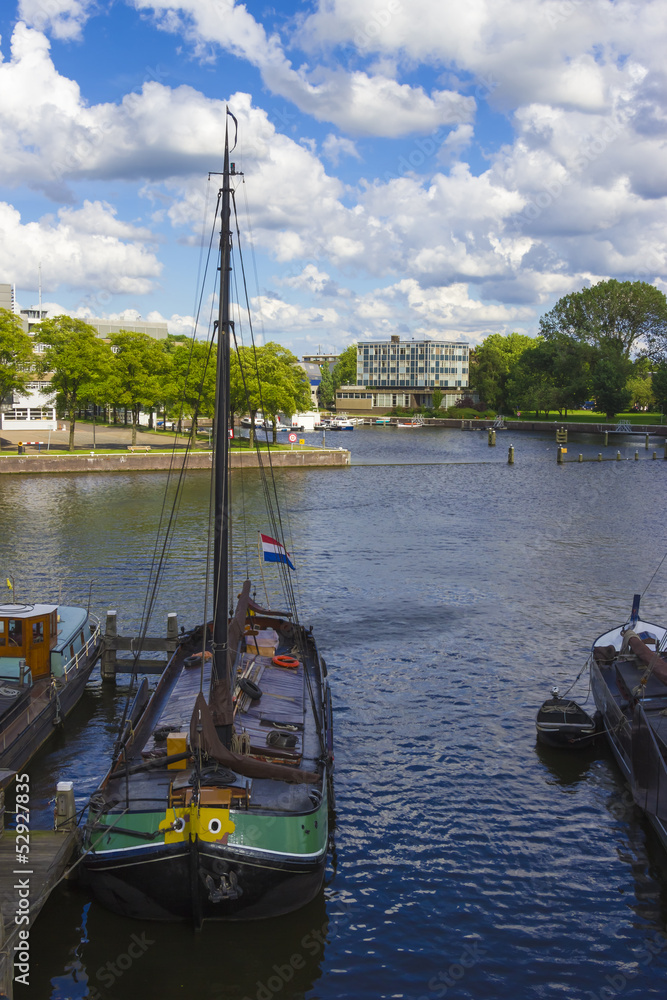 many ships parked near the shore in Amsterdam