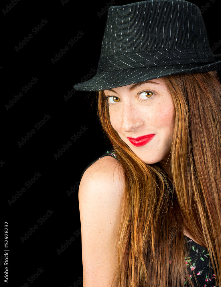 Adorable young woman with red hair and freckles wearing a pinstr Adorable young woman with red hair and freckles wearing a pinstr