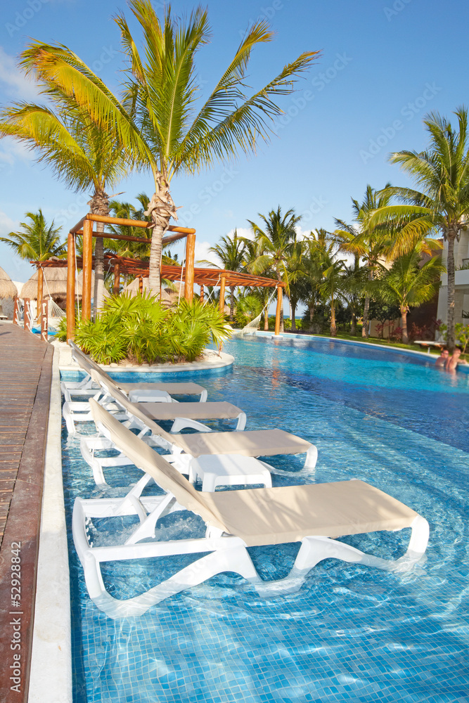 Obraz premium Swimming pool at caribbean resort.