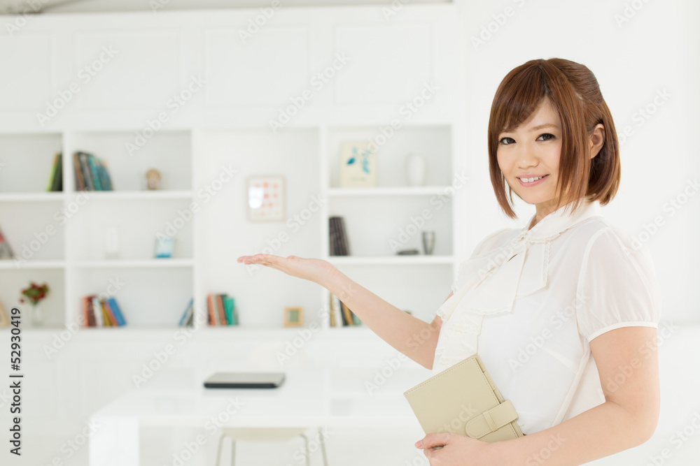 Beautiful young businesswoman working in office Beautiful young businesswoman working in office