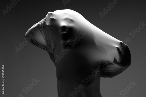 Scary Horror Image of a Woman Trapped in Fabric photo