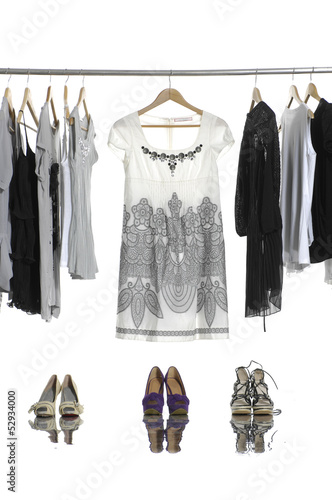 Set of casual fashion clothing on hangers and shoes
