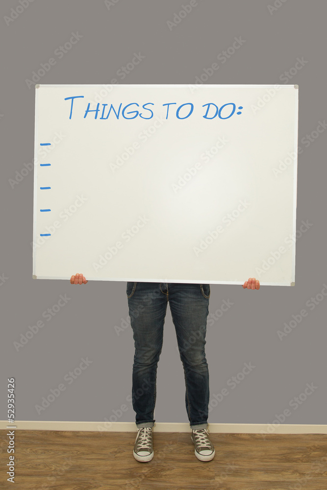 Woman holding things to do sign Woman holding things to do sign