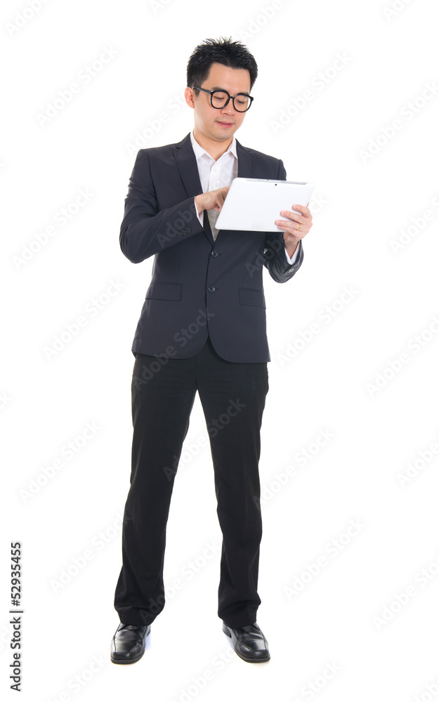 asian business male using tablet on isolated white background, f asian business male using tablet on isolated white background, f