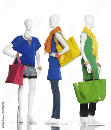 fashion dress with handbag and scarf on female three mannequin