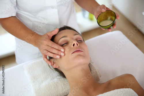 Woman receiving a face massage