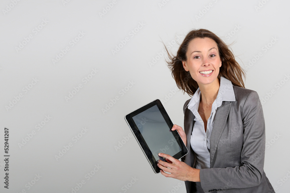 Businesswoman showing tablet screen to camera Businesswoman showing tablet screen to camera