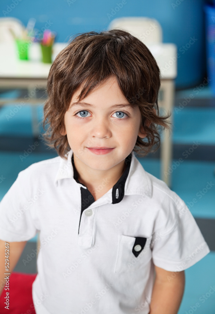 Fototapeta premium Cute Boy In Casuals At Kindergarten