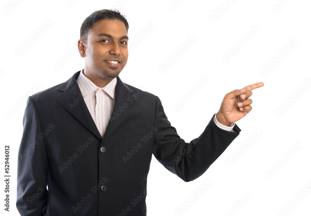 Indian business man pointing at blank space. Indian business man pointing at blank space.