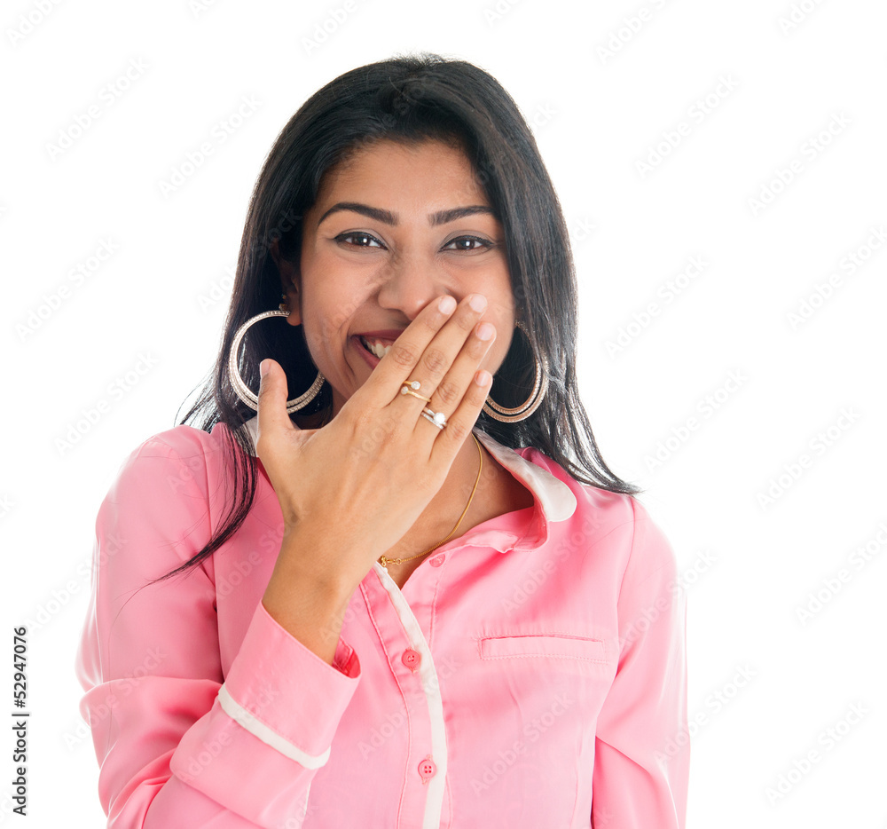Indian woman giggles covering her mouth with hand Indian woman giggles covering her mouth with hand