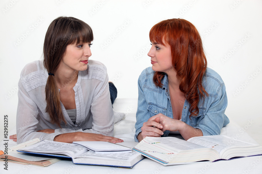 Two female friends studying.