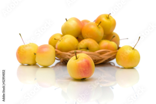 ripe apples on a white background with reflection
