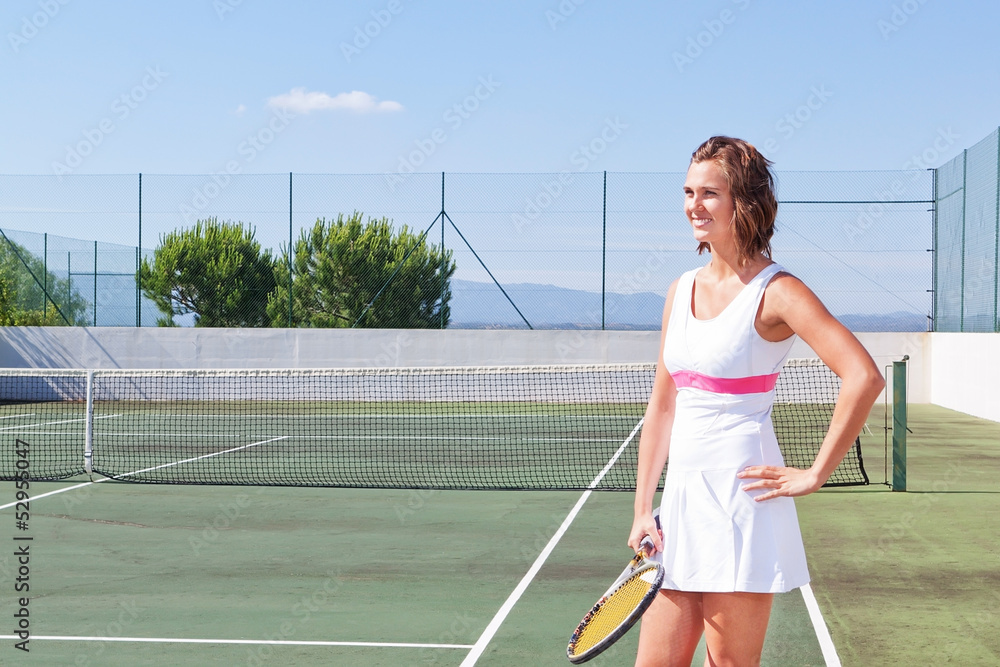 Beautiful young girl with a tennis racket ready to exercise. Clo
