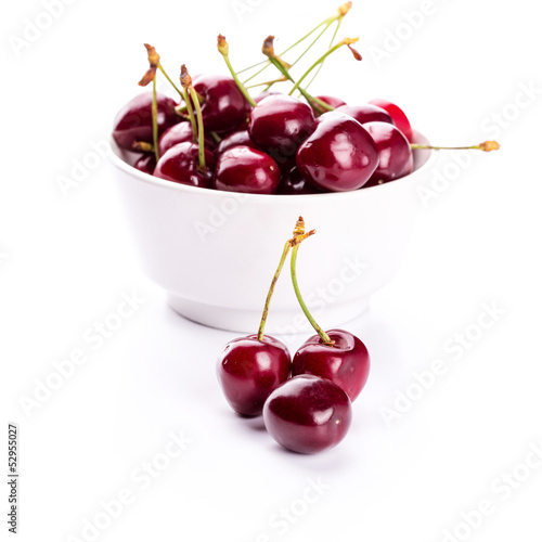 Sweet fresh cherry in a bowl isolated
