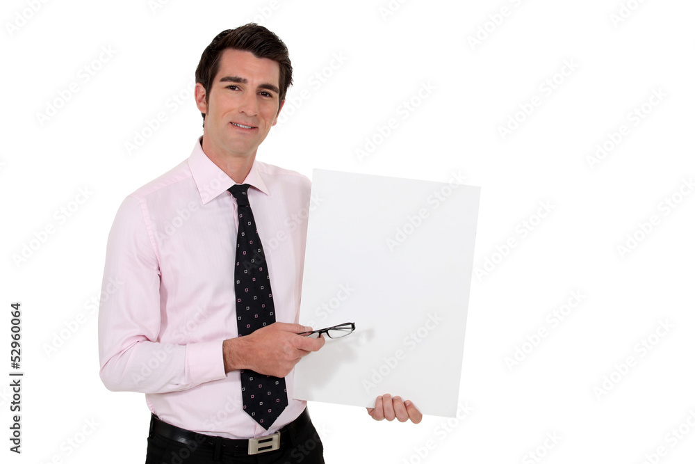Businessman stood with blank poster Businessman stood with blank poster