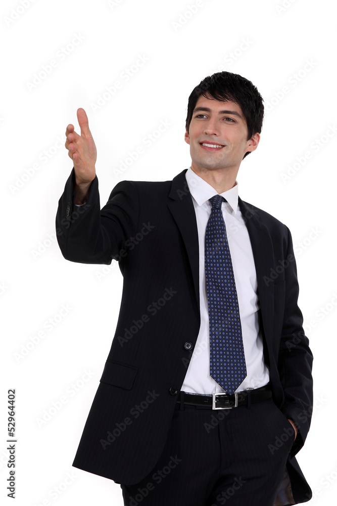 Happy businessman directing with hand Happy businessman directing with hand