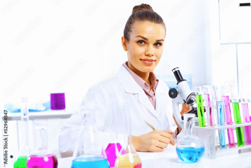 Young female scientist working in laboratory Young female scientist working in laboratory